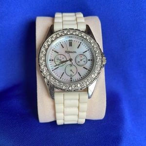 Women’s watch by Style&co. Needs battery. No missing gems. Super cute.